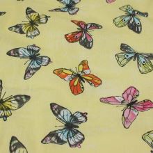 Bavlna světle žlutá, barevní motýlci, š.140